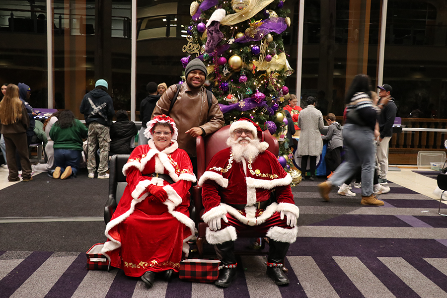 student with Santa and Mrs. Claus