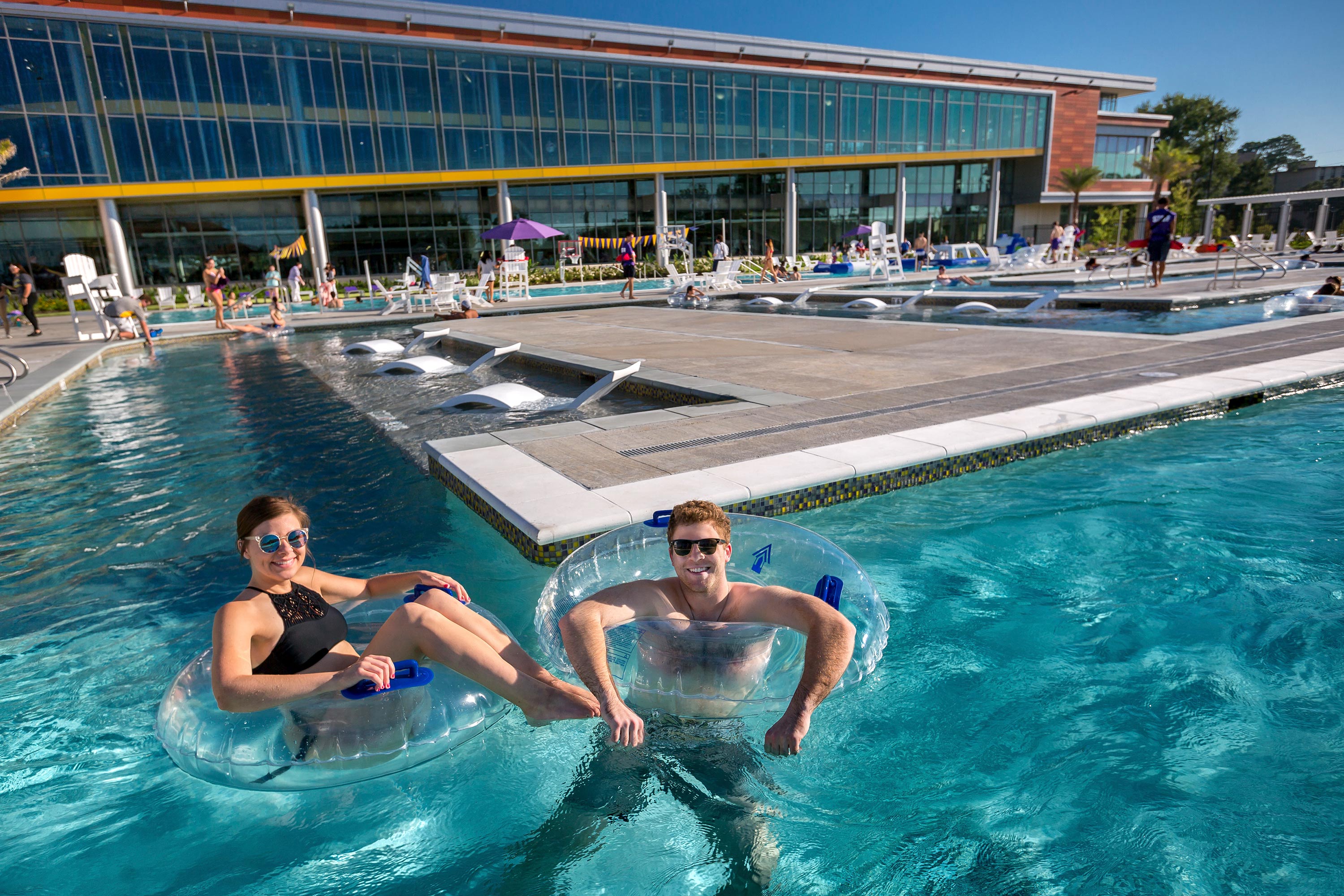 two patrons floating in leisure river