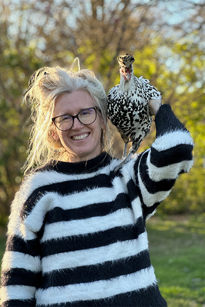 Emily Ward Bivens with a chicken on her shoulder