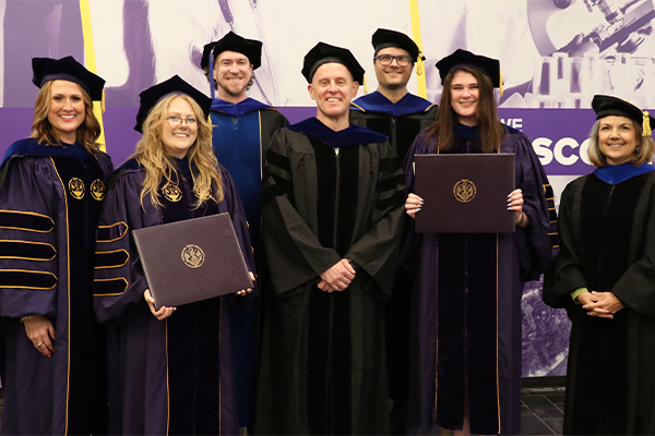 group photo of graduates in regalia