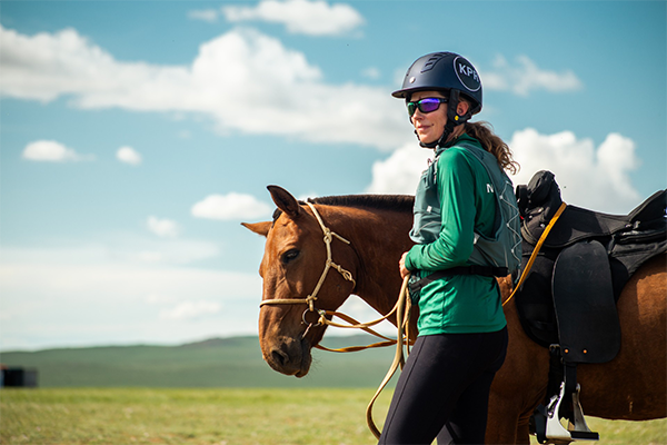 Dr. Kerry Pride with a horse in Mongolia
